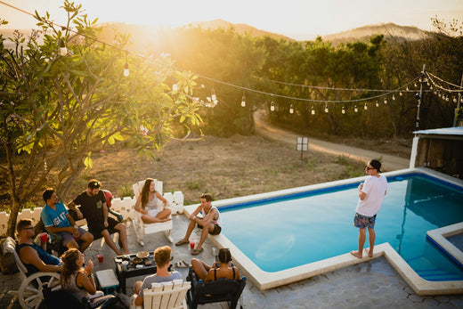 People gathered near a backyard pool